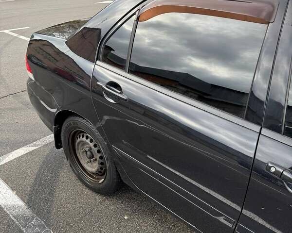 Чорний Міцубісі Lancer, об'ємом двигуна 1.6 л та пробігом 245 тис. км за 4500 $, фото 5 на Automoto.ua