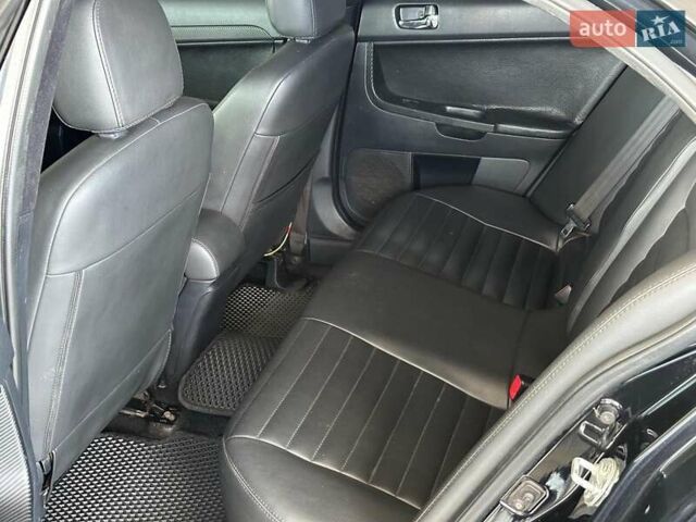 Чорний Міцубісі Lancer, об'ємом двигуна 2 л та пробігом 313 тис. км за 7690 $, фото 14 на Automoto.ua