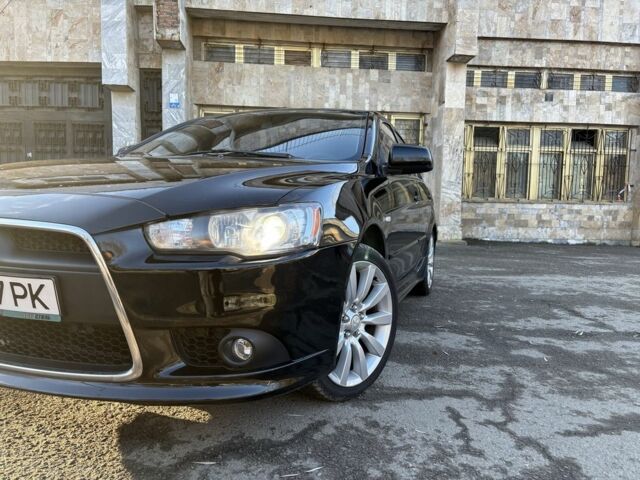 Черный Мицубиси Лансер, объемом двигателя 2 л и пробегом 236 тыс. км за 6550 $, фото 2 на Automoto.ua