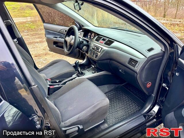 Черный Мицубиси Лансер, объемом двигателя 1.6 л и пробегом 216 тыс. км за 5190 $, фото 11 на Automoto.ua