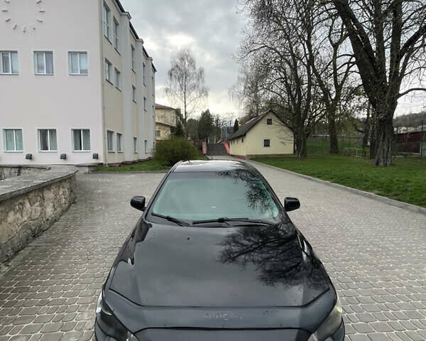 Черный Мицубиси Лансер, объемом двигателя 2 л и пробегом 165 тыс. км за 6900 $, фото 12 на Automoto.ua