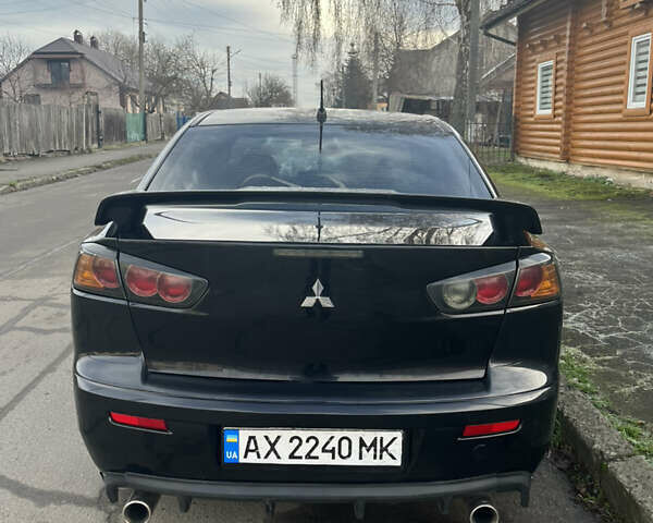 Черный Мицубиси Лансер, объемом двигателя 2 л и пробегом 270 тыс. км за 5400 $, фото 4 на Automoto.ua