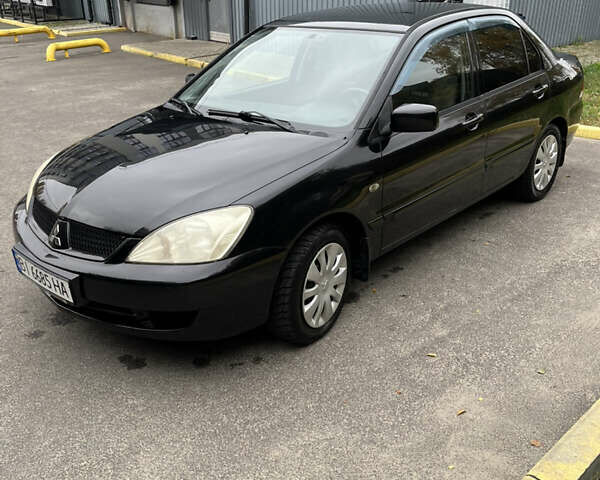 Чорний Міцубісі Lancer, об'ємом двигуна 1.58 л та пробігом 192 тис. км за 4500 $, фото 5 на Automoto.ua