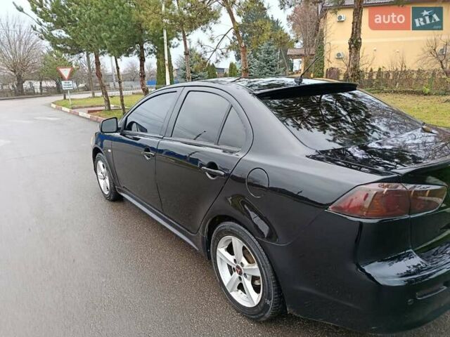 Черный Мицубиси Лансер, объемом двигателя 2 л и пробегом 200 тыс. км за 5100 $, фото 14 на Automoto.ua