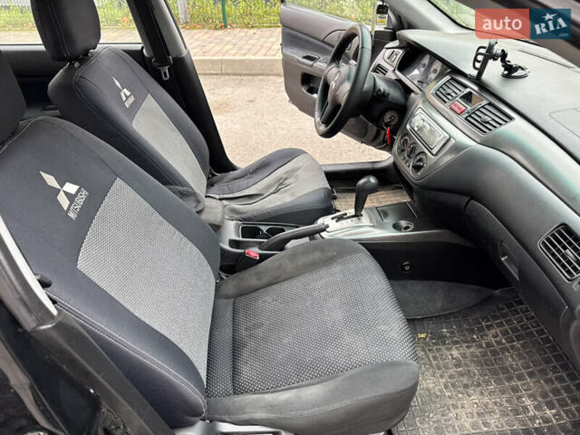 Чорний Міцубісі Lancer, об'ємом двигуна 1.58 л та пробігом 388 тис. км за 2300 $, фото 11 на Automoto.ua