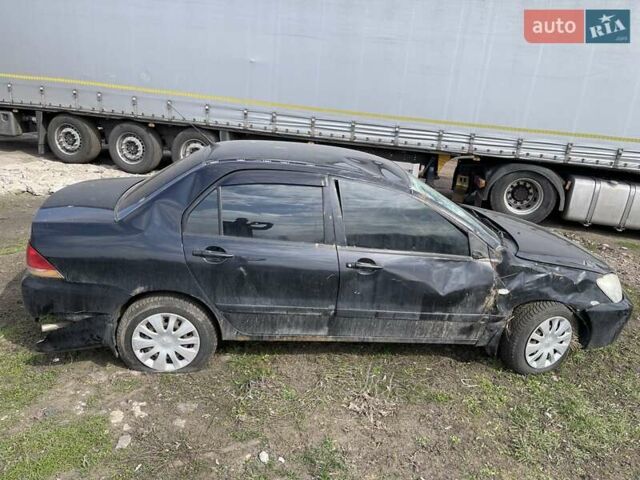 Чорний Міцубісі Lancer, об'ємом двигуна 1.6 л та пробігом 216 тис. км за 1800 $, фото 1 на Automoto.ua