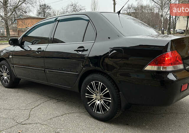 Чорний Міцубісі Lancer, об'ємом двигуна 1.58 л та пробігом 167 тис. км за 4800 $, фото 2 на Automoto.ua