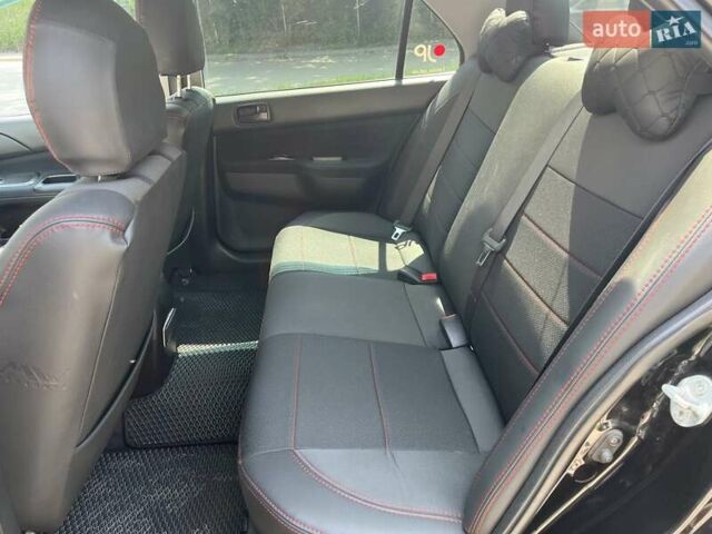 Чорний Міцубісі Lancer, об'ємом двигуна 1.6 л та пробігом 296 тис. км за 4200 $, фото 30 на Automoto.ua