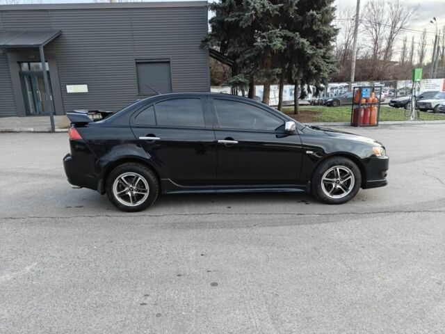 Черный Мицубиси Лансер, объемом двигателя 2 л и пробегом 245 тыс. км за 5600 $, фото 6 на Automoto.ua