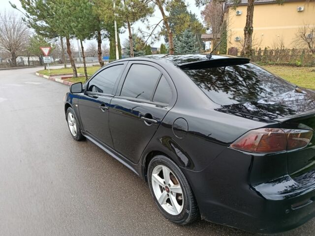 Черный Мицубиси Лансер, объемом двигателя 2 л и пробегом 200 тыс. км за 5100 $, фото 5 на Automoto.ua