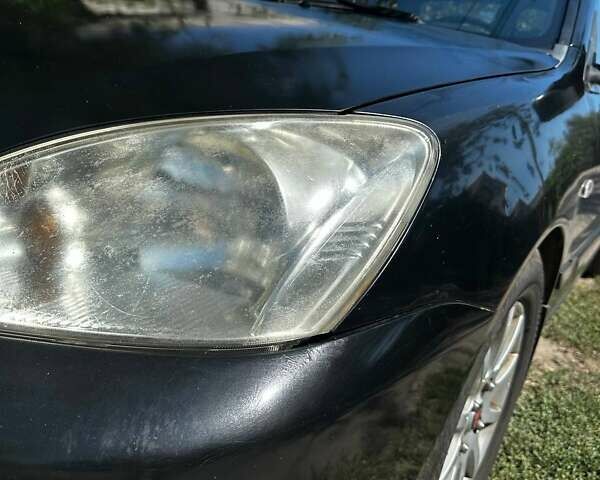 Чорний Міцубісі Lancer, об'ємом двигуна 1.6 л та пробігом 294 тис. км за 6500 $, фото 2 на Automoto.ua