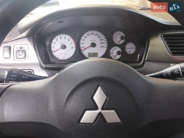 Чорний Міцубісі Lancer, об'ємом двигуна 1.58 л та пробігом 323 тис. км за 4500 $, фото 1 на Automoto.ua