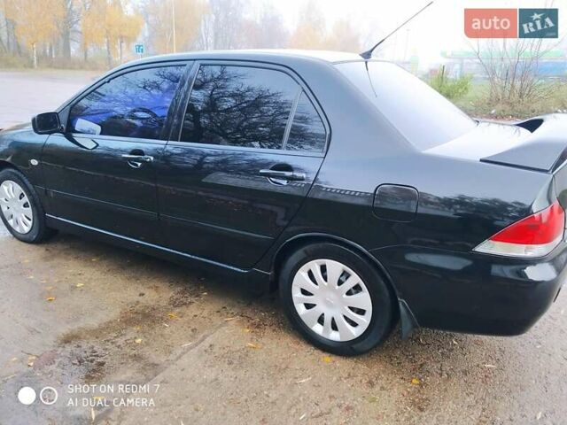 Мицубиси Лансер 2008 в Прилуках на Automoto.ua Черный Мицубиси Лансер, объемом двигателя 1.58 л и пробегом 219 тыс. км за 4900 $, фото 4 на Automoto.ua