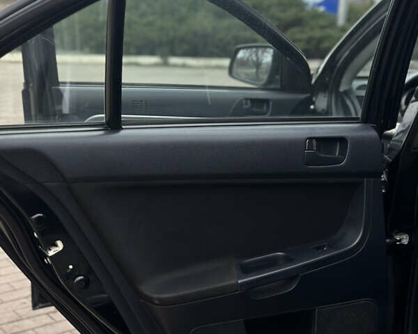Чорний Міцубісі Lancer, об'ємом двигуна 1.5 л та пробігом 111 тис. км за 6999 $, фото 44 на Automoto.ua