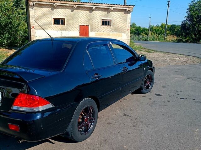Чорний Міцубісі Lancer, об'ємом двигуна 1.6 л та пробігом 0 тис. км за 4200 $, фото 8 на Automoto.ua