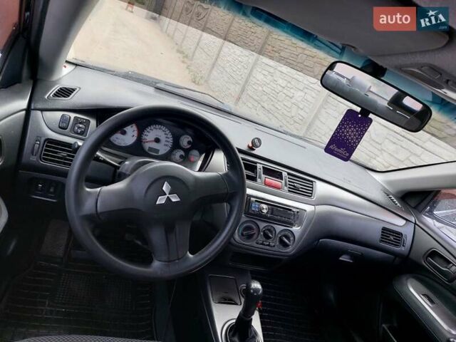 Чорний Міцубісі Lancer, об'ємом двигуна 1.6 л та пробігом 215 тис. км за 4900 $, фото 12 на Automoto.ua