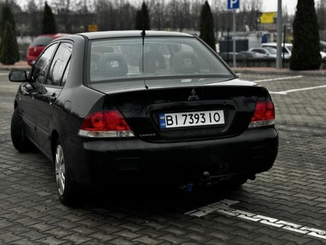 Черный Мицубиси Лансер, объемом двигателя 1.6 л и пробегом 168 тыс. км за 3700 $, фото 6 на Automoto.ua