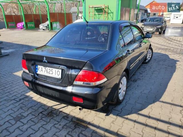 Чорний Міцубісі Lancer, об'ємом двигуна 1.6 л та пробігом 335 тис. км за 3100 $, фото 7 на Automoto.ua