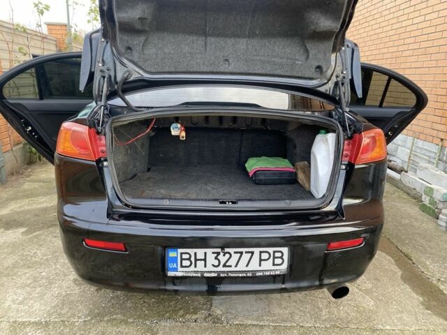 Черный Мицубиси Лансер, объемом двигателя 2 л и пробегом 140 тыс. км за 7200 $, фото 4 на Automoto.ua