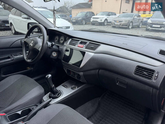 Черный Мицубиси Лансер, объемом двигателя 1.58 л и пробегом 202 тыс. км за 4100 $, фото 25 на Automoto.ua