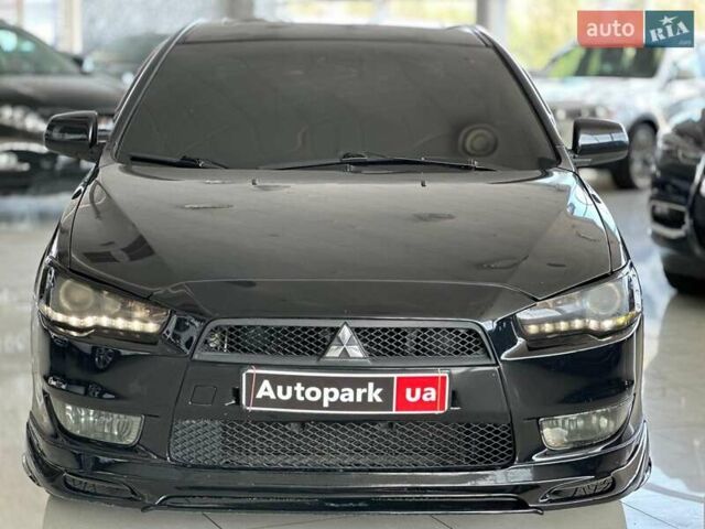 Чорний Міцубісі Lancer, об'ємом двигуна 2 л та пробігом 313 тис. км за 7690 $, фото 1 на Automoto.ua