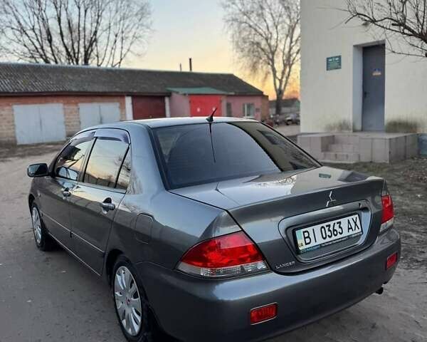 Черный Мицубиси Лансер, объемом двигателя 1.6 л и пробегом 225 тыс. км за 3400 $, фото 15 на Automoto.ua