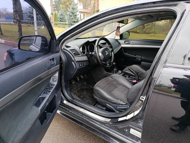 Черный Мицубиси Лансер, объемом двигателя 2 л и пробегом 200 тыс. км за 5100 $, фото 4 на Automoto.ua