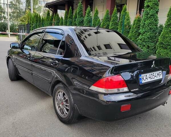 Чорний Міцубісі Lancer, об'ємом двигуна 1.58 л та пробігом 334 тис. км за 4750 $, фото 6 на Automoto.ua