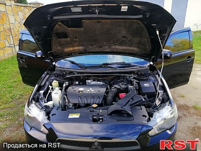 Черный Мицубиси Лансер, объемом двигателя 2 л и пробегом 196 тыс. км за 5500 $, фото 9 на Automoto.ua