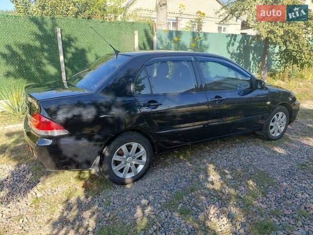 Чорний Міцубісі Lancer, об'ємом двигуна 1.6 л та пробігом 221 тис. км за 5200 $, фото 6 на Automoto.ua