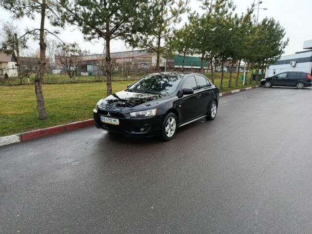 Черный Мицубиси Лансер, объемом двигателя 2 л и пробегом 200 тыс. км за 5100 $, фото 1 на Automoto.ua