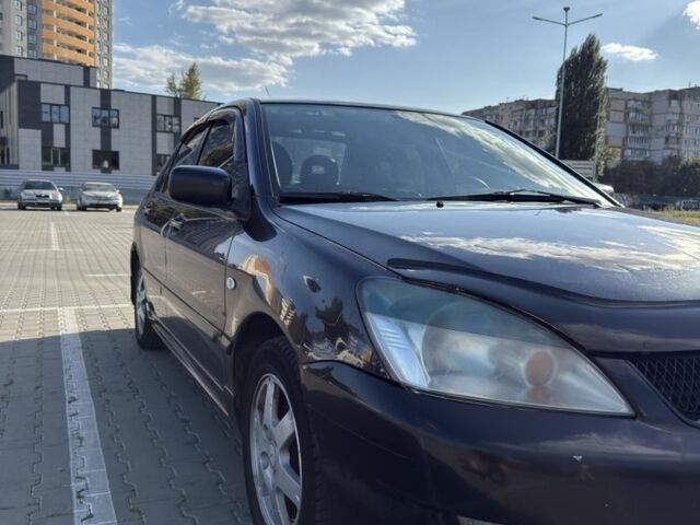 Чорний Міцубісі Lancer, об'ємом двигуна 1.6 л та пробігом 364 тис. км за 3000 $, фото 3 на Automoto.ua