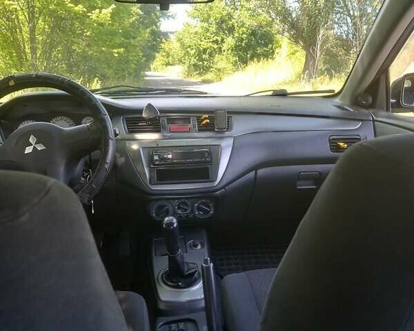 Черный Мицубиси Лансер, объемом двигателя 1.6 л и пробегом 320 тыс. км за 3800 $, фото 3 на Automoto.ua