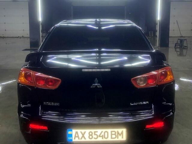 Чорний Міцубісі Lancer, об'ємом двигуна 2 л та пробігом 126 тис. км за 5800 $, фото 3 на Automoto.ua