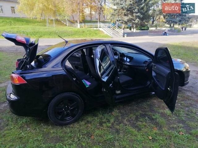 Мицубиси Лансер 2008 в Киеве на Automoto.ua Черный Мицубиси Лансер, объемом двигателя 2 л и пробегом 196 тыс. км за 5500 $, фото 27 на Automoto.ua