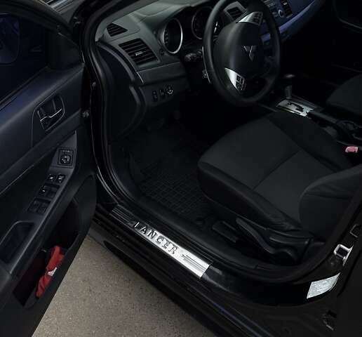 Черный Мицубиси Лансер, объемом двигателя 2 л и пробегом 222 тыс. км за 6000 $, фото 11 на Automoto.ua