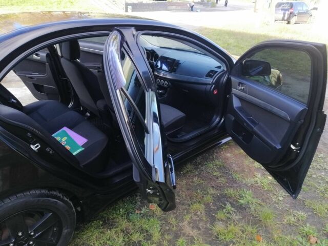 Міцубісі Lancer 2008 у Києві на Automoto.ua Чорний Міцубісі Lancer, об'ємом двигуна 2 л та пробігом 196 тис. км за 5500 $, фото 17 на Automoto.ua