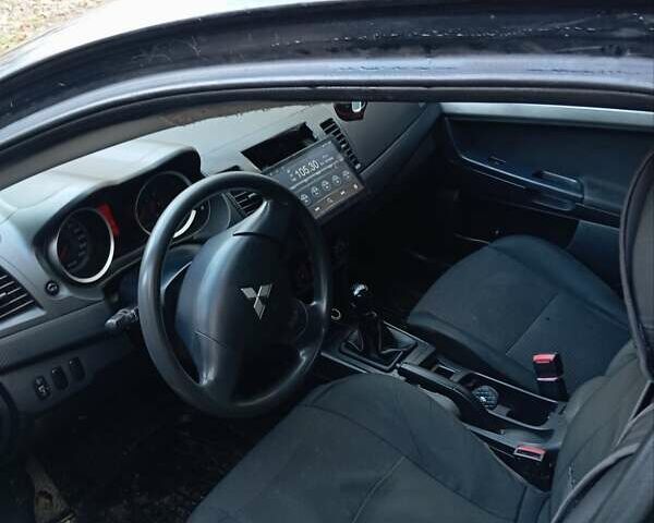 Черный Мицубиси Лансер, объемом двигателя 1.5 л и пробегом 235 тыс. км за 4500 $, фото 1 на Automoto.ua