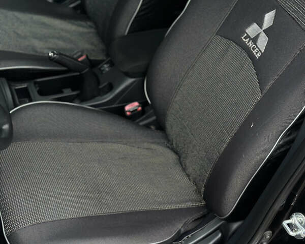 Чорний Міцубісі Lancer, об'ємом двигуна 1.5 л та пробігом 111 тис. км за 6999 $, фото 41 на Automoto.ua