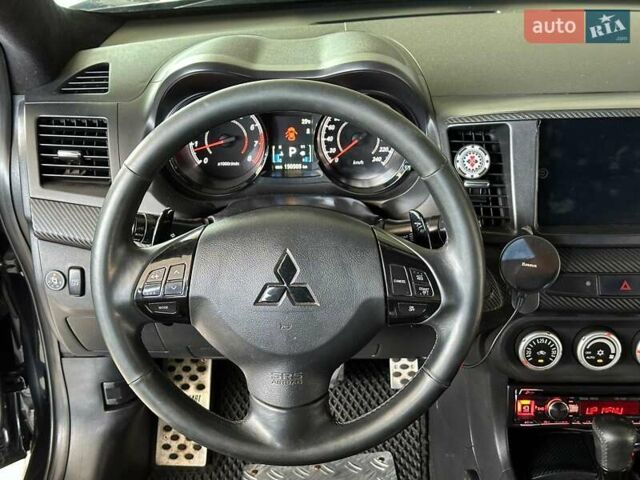 Чорний Міцубісі Lancer, об'ємом двигуна 2 л та пробігом 313 тис. км за 7690 $, фото 18 на Automoto.ua
