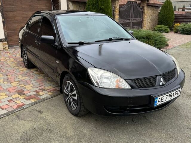 Чорний Міцубісі Lancer, об'ємом двигуна 1.6 л та пробігом 220 тис. км за 3600 $, фото 1 на Automoto.ua