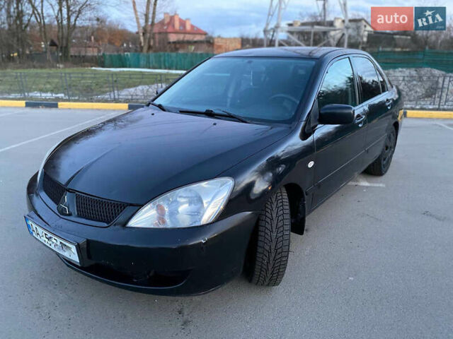 Чорний Міцубісі Lancer, об'ємом двигуна 1.58 л та пробігом 327 тис. км за 4000 $, фото 10 на Automoto.ua