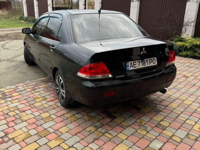 Чорний Міцубісі Lancer, об'ємом двигуна 1.6 л та пробігом 220 тис. км за 3600 $, фото 6 на Automoto.ua