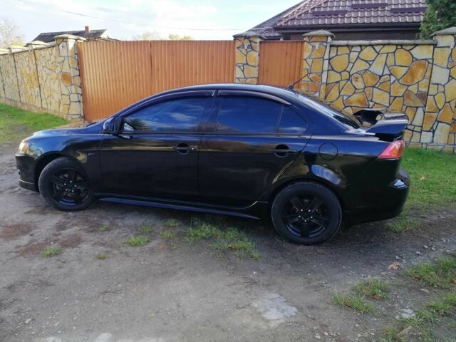 Міцубісі Lancer 2008 у Києві на Automoto.ua Чорний Міцубісі Lancer, об'ємом двигуна 2 л та пробігом 196 тис. км за 5500 $, фото 3 на Automoto.ua