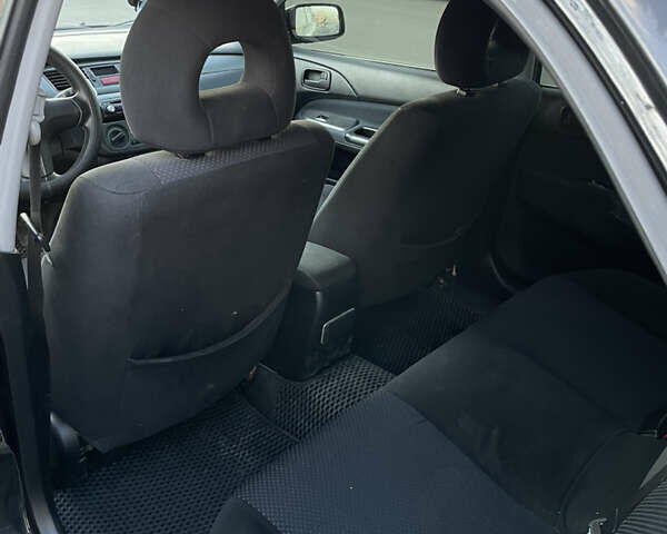 Черный Мицубиси Лансер, объемом двигателя 1.59 л и пробегом 348 тыс. км за 4200 $, фото 4 на Automoto.ua