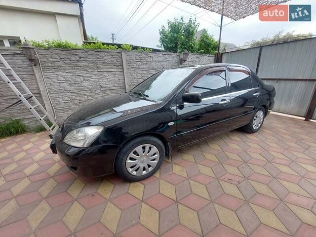 Чорний Міцубісі Lancer, об'ємом двигуна 1.6 л та пробігом 215 тис. км за 4900 $, фото 3 на Automoto.ua