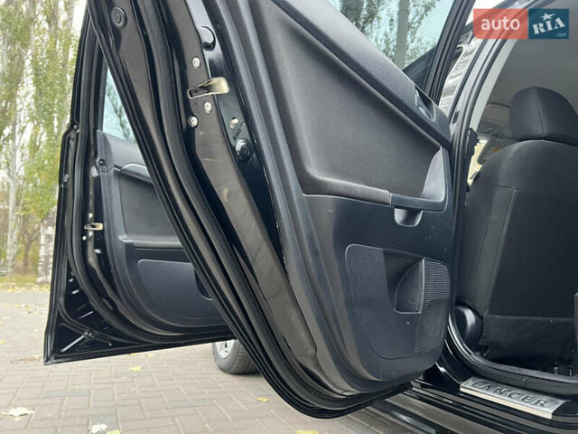Чорний Міцубісі Lancer, об'ємом двигуна 2 л та пробігом 216 тис. км за 7150 $, фото 15 на Automoto.ua