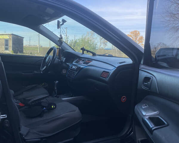 Мицубиси Лансер 2008 в Киеве на Automoto.ua Черный Мицубиси Лансер, объемом двигателя 1.6 л и пробегом 72 тыс. км за 2650 $, фото 9 на Automoto.ua