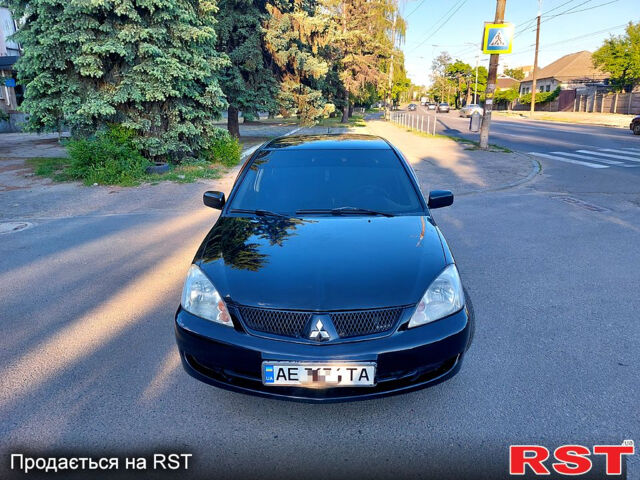 Черный Мицубиси Лансер, объемом двигателя 1.6 л и пробегом 216 тыс. км за 4500 $, фото 2 на Automoto.ua