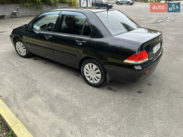 Чорний Міцубісі Lancer, об'ємом двигуна 1.58 л та пробігом 192 тис. км за 4500 $, фото 4 на Automoto.ua